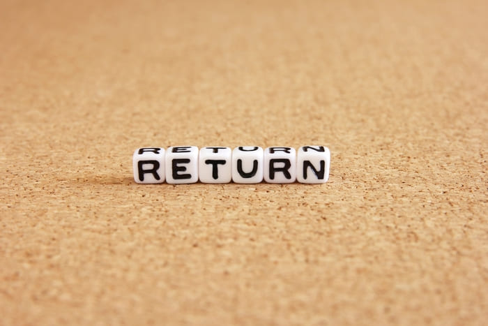 RETURNと書かれた白いサイコロ